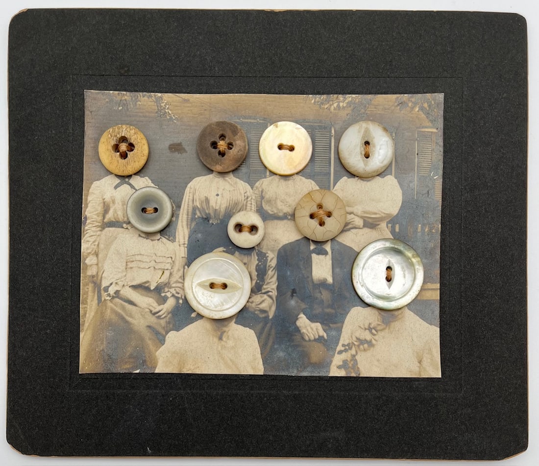 ANTIQUE EERIE OUTSIDER FOLK ART RARE GOTHIC PHOTO COLLAGE W BUTTONS: Antique eerie outsider folk art photo collage featuring an antique studio portrait altered with sewn-on buttons replacing the subjects’ faces. Mounted on original card stock with visible stitching o