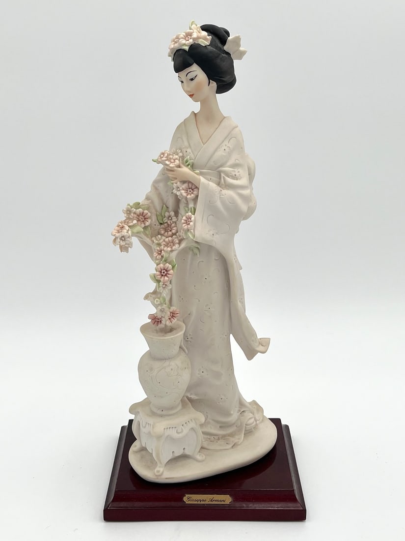 Giuseppe Armani Porcelain Oriental Lady Geisha with Flowers Sculpture Figurine: Original Porcelain Sculpture by Giuseppe Armani. Signed. Doll height 13.5” approx Base 5.5” x 4.2” approx. SHIPPING IN THE U.S VIA USPS PRIORITY MAIL $20