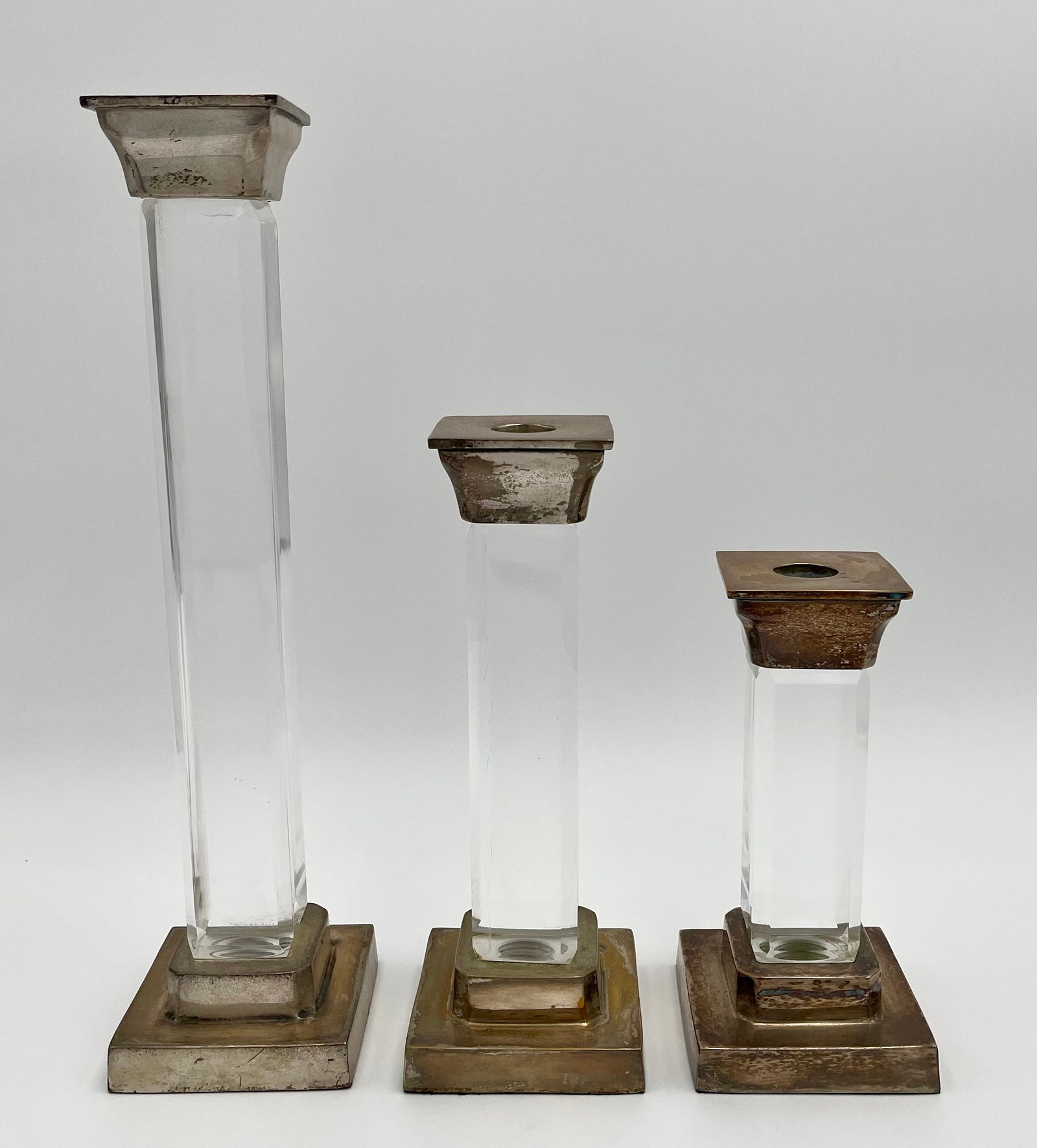 Vintage Lucite Candlestick Holders Set of 3 Charles Hollis Jones Style MCM: Set of three vintage candlestick holders featuring clear Lucite columns with silver-tone metal bases and tops. Elegant Mid-Century Modern design in the style of Charles Hollis Jones, known for his