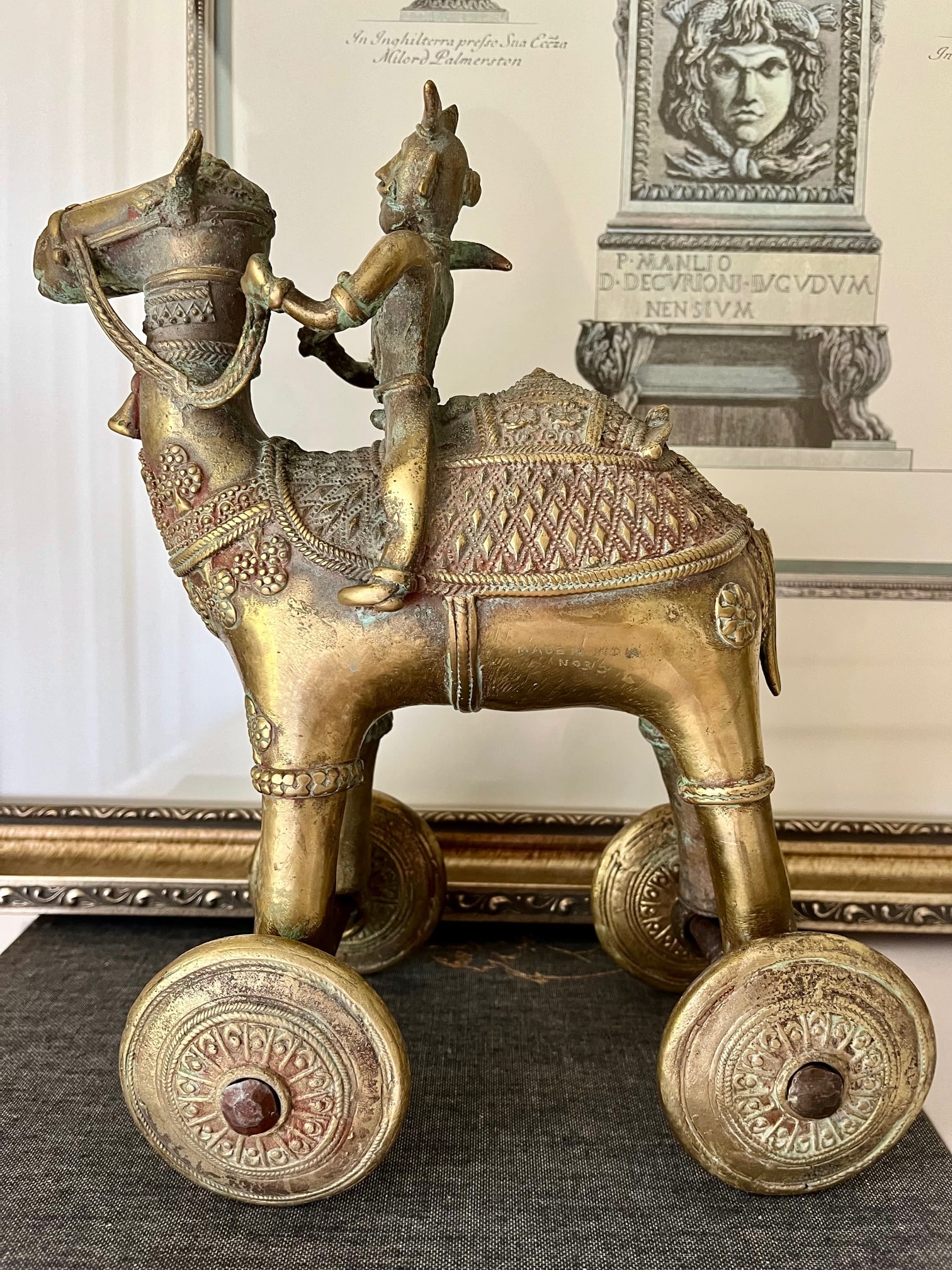 LARGE ANTIQUE INDIA TEMPLE TOY NUMBERED: Solid Brass Numbered Large and heavy Antique Indian Camel on Wheels. Beautiful intricate design. Size: 12 inches Tall by 8 inches by 6 inches wide Approximately. SHIPPING IN THE U.S VIA USPS PRIORITY 