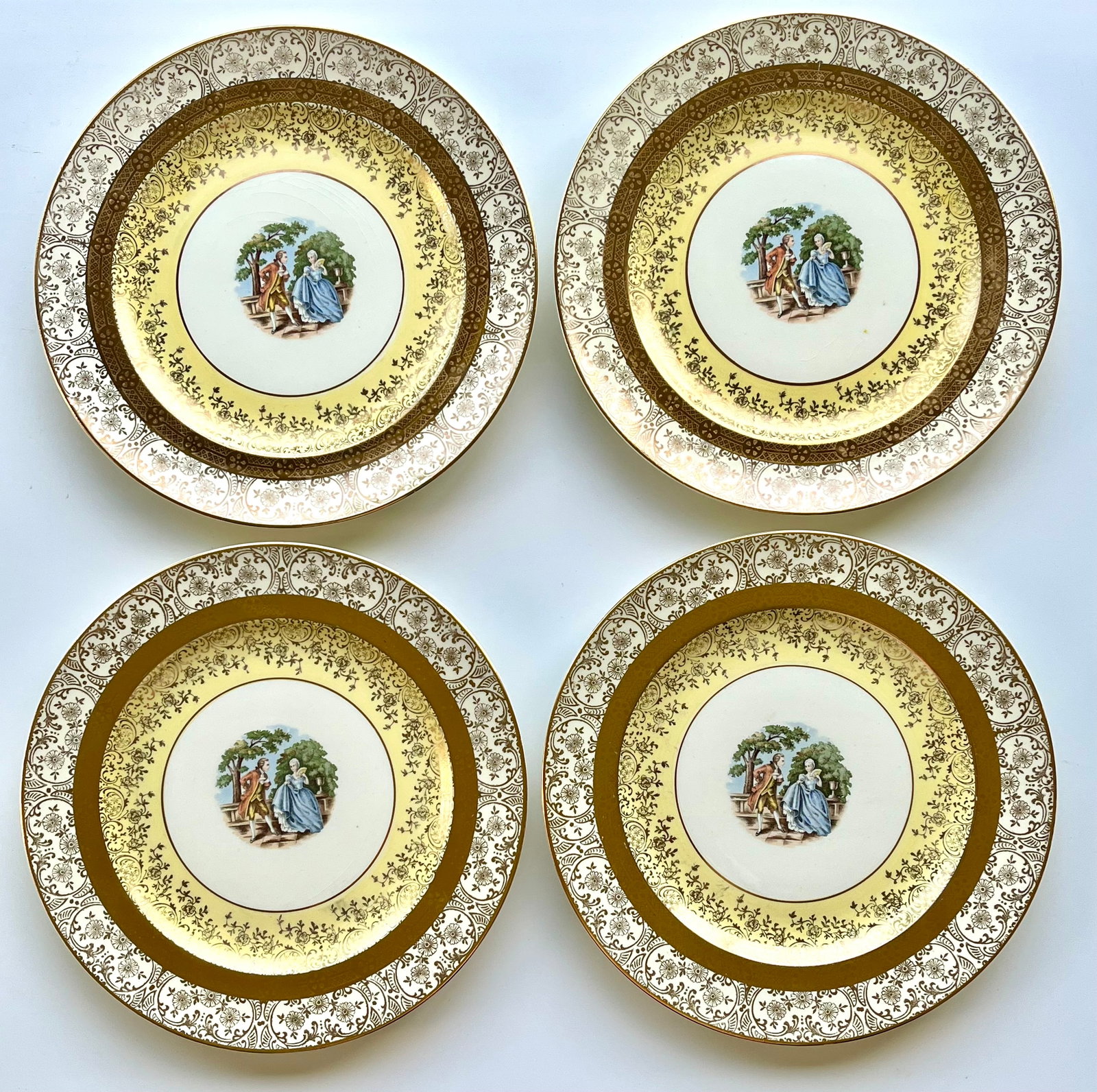 Victorian Style Porcelain Bromley Plates Set of 4 –22K Gold Trim 9: Set of 4 vintage Bromley decorative plates featuring a romantic courting couple scene in the center. Elegant ornate border with rich 22K gold trim. Marked on back: Bromley – Decorated – 22 Karat