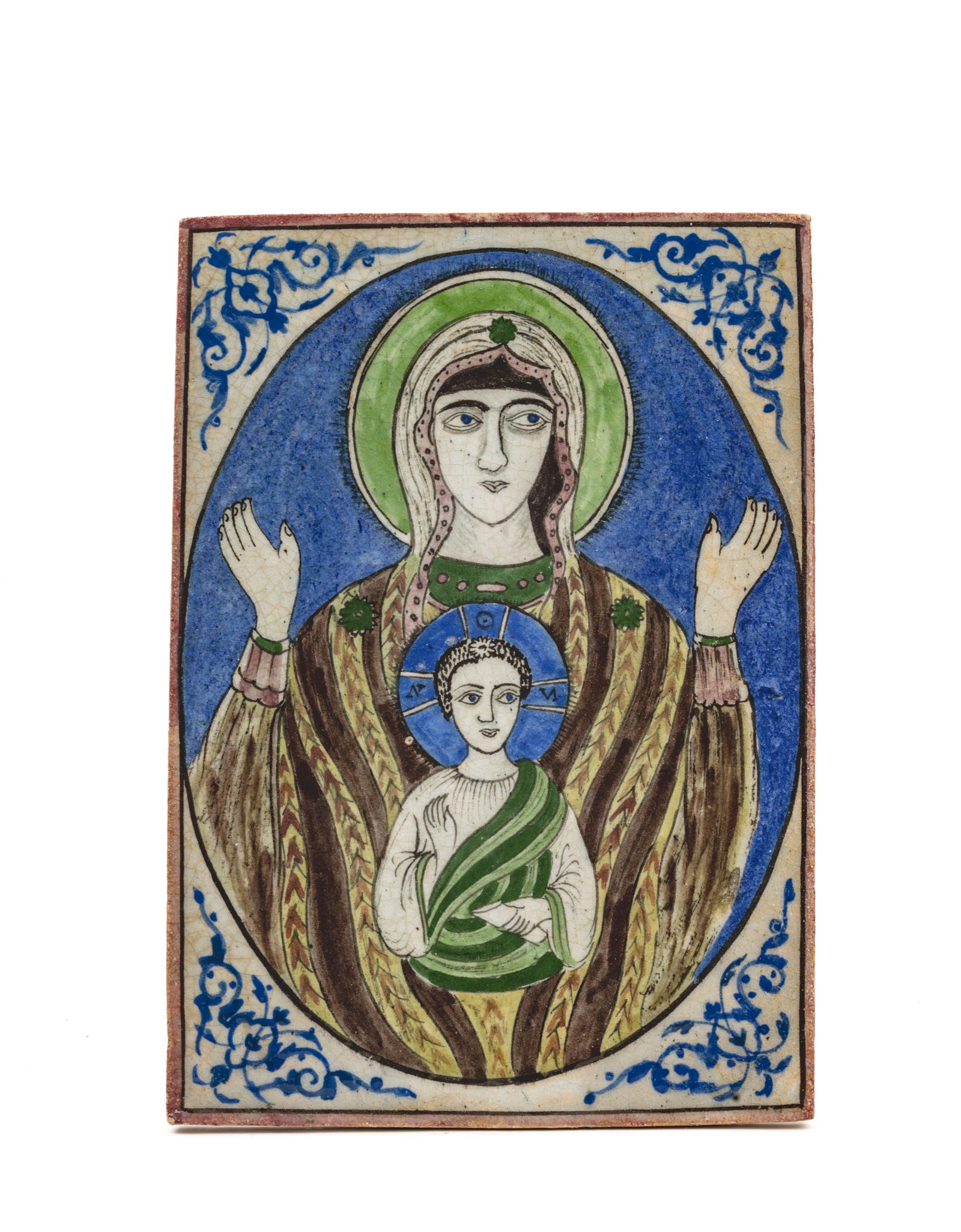 Virgin Mary and Child, Qadjar PersiaCeramic tile in the typical style of the Qadjar period: Virgin Mary and Child, Qadjar PersiaCeramic tile in the typical style of the Qadjar period (Qajar/Kadjar) in shades of green, brown and blue, with the Virgin Mary in an oval medallion on a blue backgr