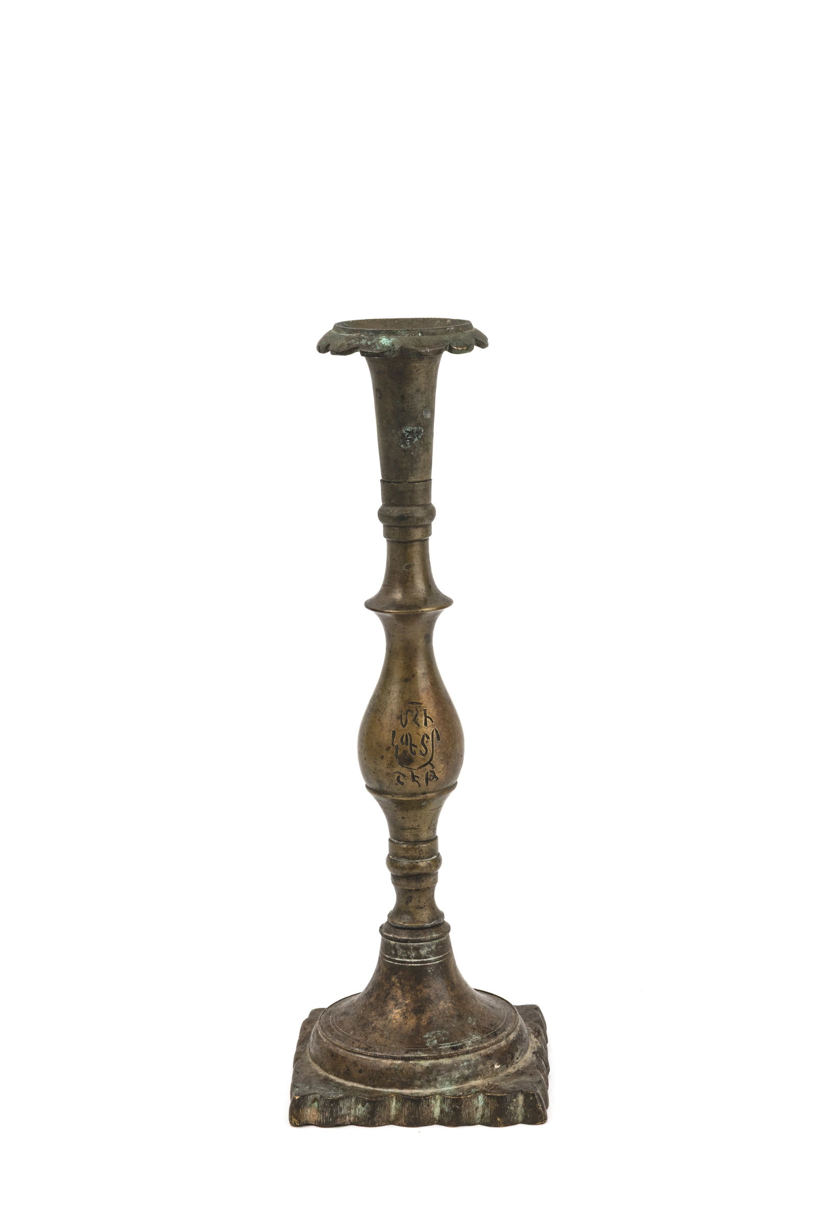 Copper candlestick with square baseWith short Armenian inscription on the bulb.Ottoman Armenia, 19th: Copper candlestick with square baseWith short Armenian inscription on the bulb.Ottoman Armenia, 19th century.H: 29 cm.