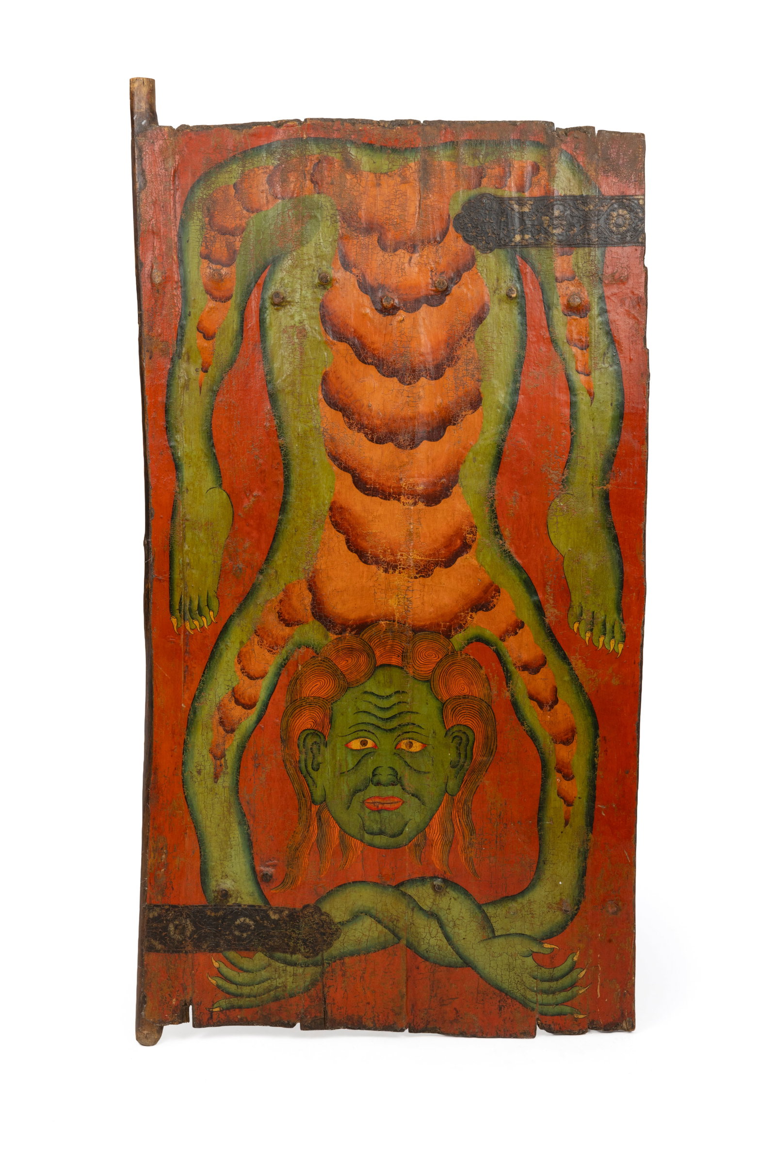 A Tibetan oratory door: A Tibetan oratory doorTempera painting on wood with iron fittings.Tibet, 19th or 20th century.37 x 74.6 cm (54 x 29 3/8 inches).Provenance: Bonham's, The Triay Collection ofHimalayan Art, Paris, Decem