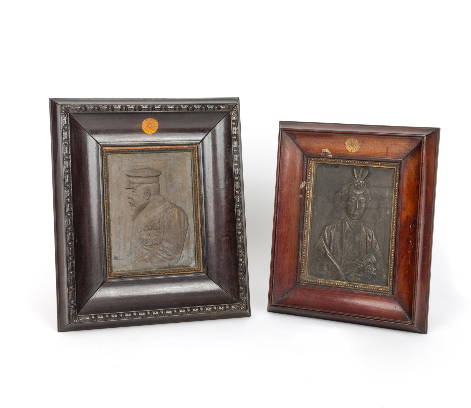 Unno Bisei (1864-1919): Unno Bisei (1864-1919)Portraits of the Meiji Emperor and EmpressPair of repoussé silver portraits.Japan, circa 1890.22.5 x 16.5 cm each (framed 39 x 33 cm).In their original stained oak frames,