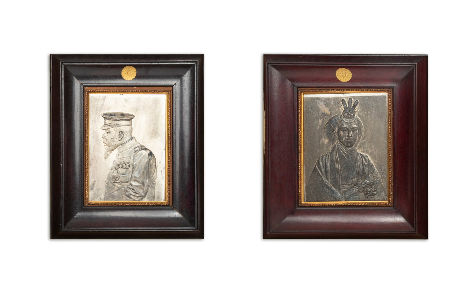 Unno Bisei (1864-1919): Unno Bisei (1864-1919)Portraits of the Meiji Emperor and EmpressPair of repoussé silver portraits.Japan, circa 1890. Acquired from the Meiji Shrine around 1920.23 x 16 cm each (framed 38 x 33