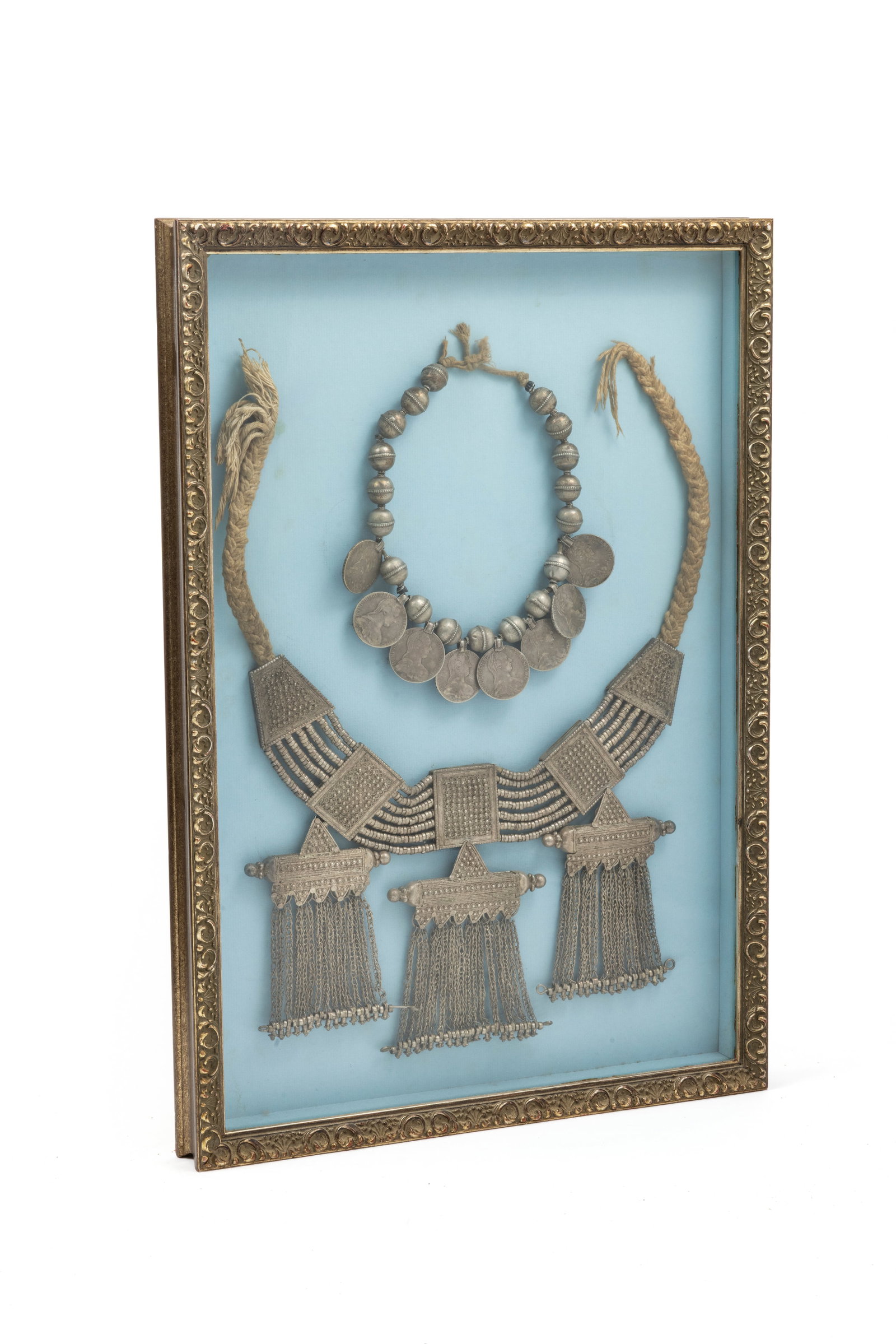 Two ethnic silver necklaces: Two ethnic silver necklacesThe smaller one contains eight silver thalers in the effigy of Maria Theresa, Empress of the Holy Roman Empire (1745-1765), alternating with silver spheres.The largest is a