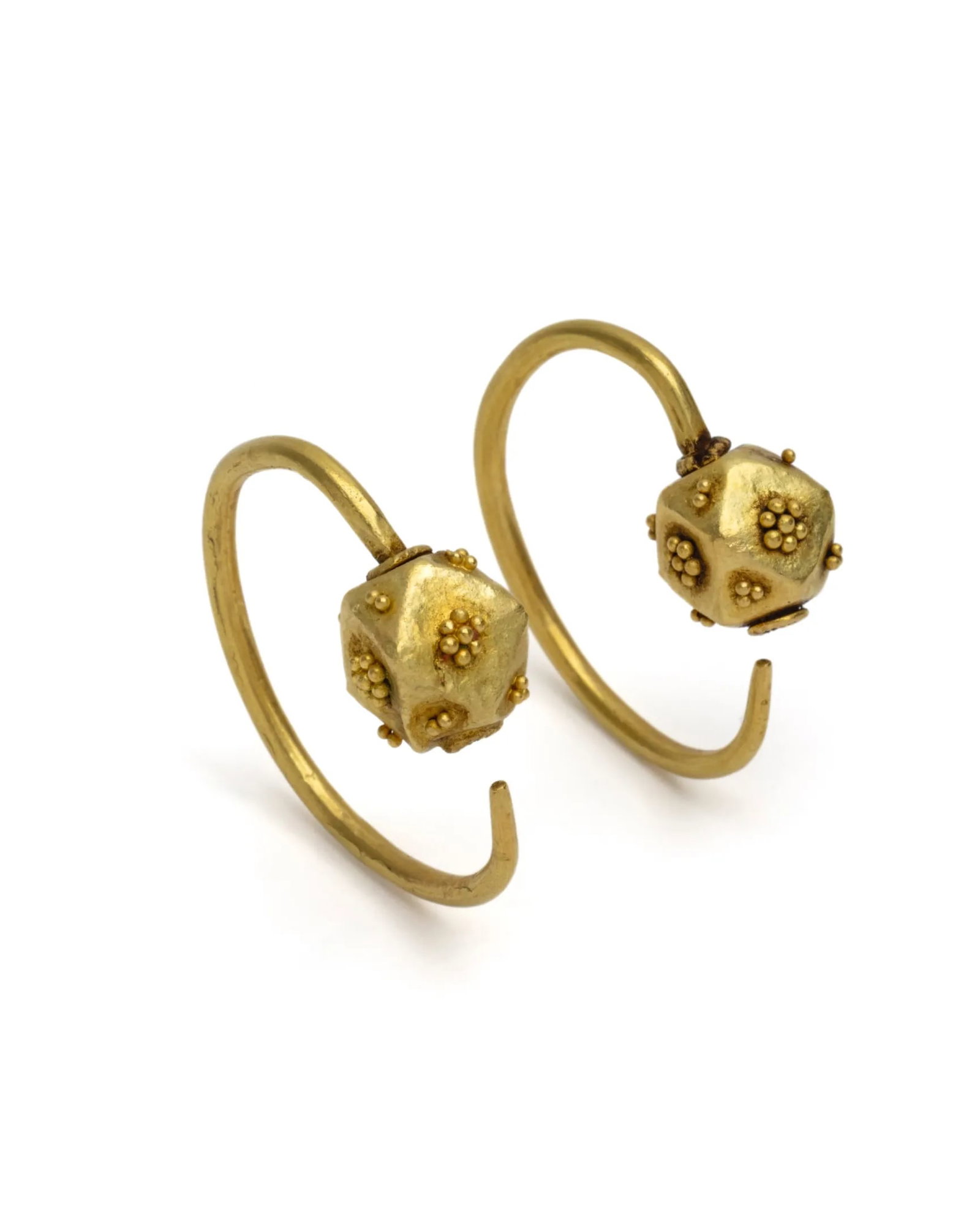 Pair of Ostrogothic gold earrings: Pair of gold ostrogothic earrings Each with a penannular ear wire, round cross-section, one end attached to a hollow polygonal bead, the other end tapered, the four main faces of the bead with a