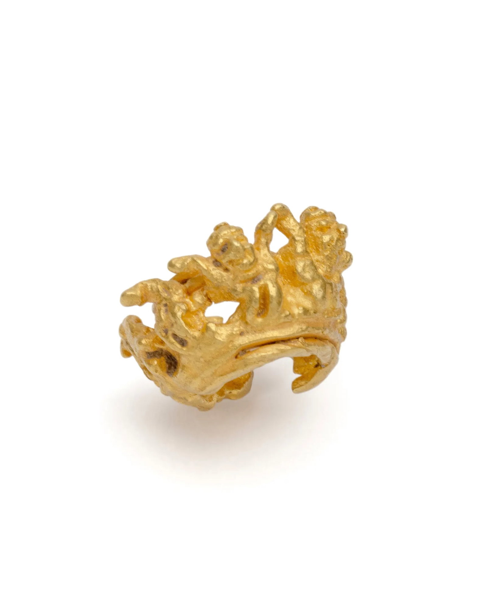 Java, gold ornament: Java, gold ornamentSolid gold cylindrical ornament in the shape of a C (i.e. a ring with a lateral slit), its sides tapered and openworked.It is adorned with at least three anthropomorphic figures,