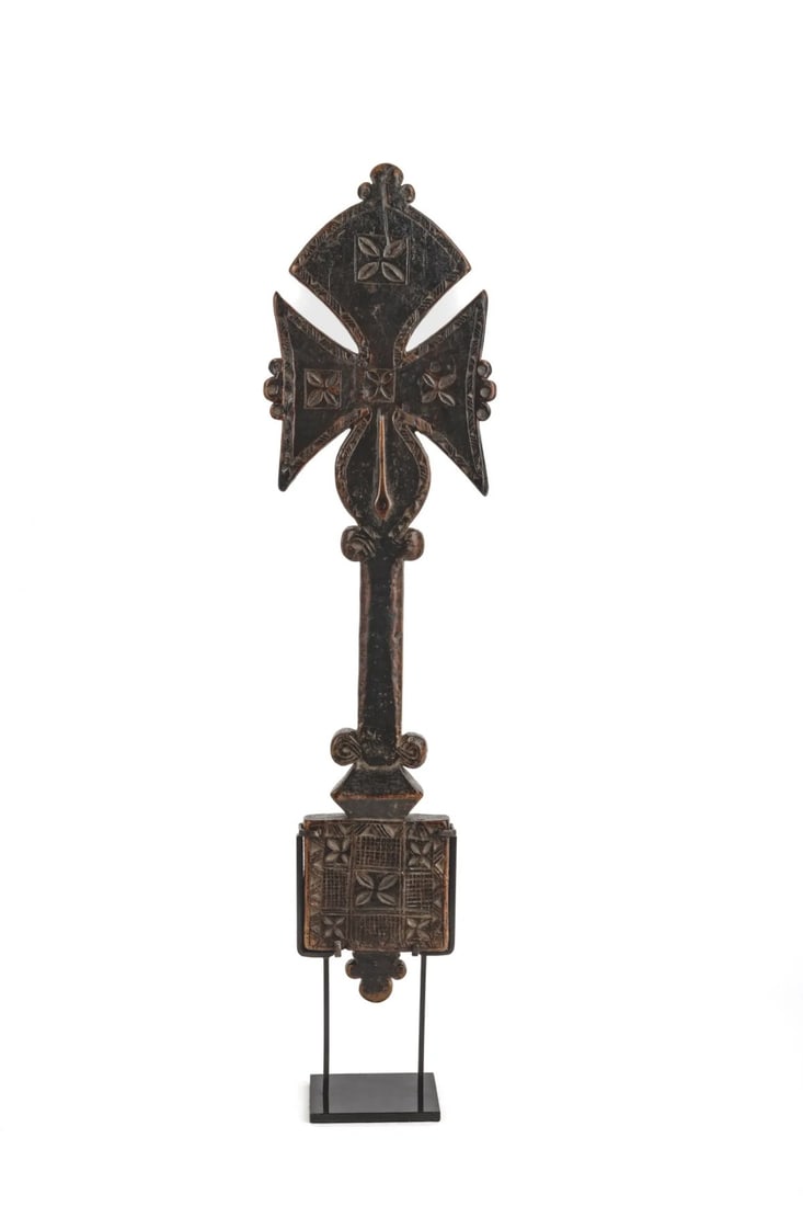 Olive wood blessing cross: Unusually shaped olive wood blessing cross, with a rounded upper branch and a snake on the lower branch.48 x 13 cm.Ethiopia, late 17th century.Provenance: Sam Fogg Gallery, London.