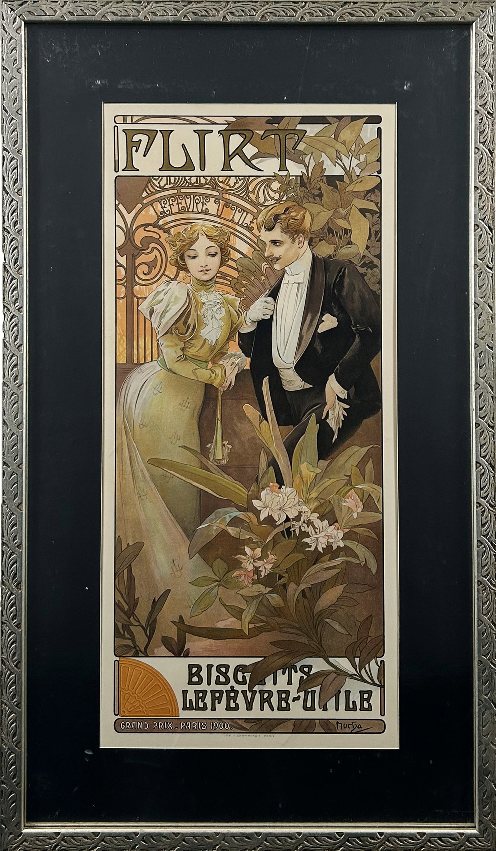 Alphonse Mucha "Biscuits Lefevre - Utile" Color Lithograph: One print on paper depicting an advertisement for Levere cookies. The woman wears a green dress with mutton sleeves and the man wears a suit with a white tie and dinner jacket. Both figures lean casua
