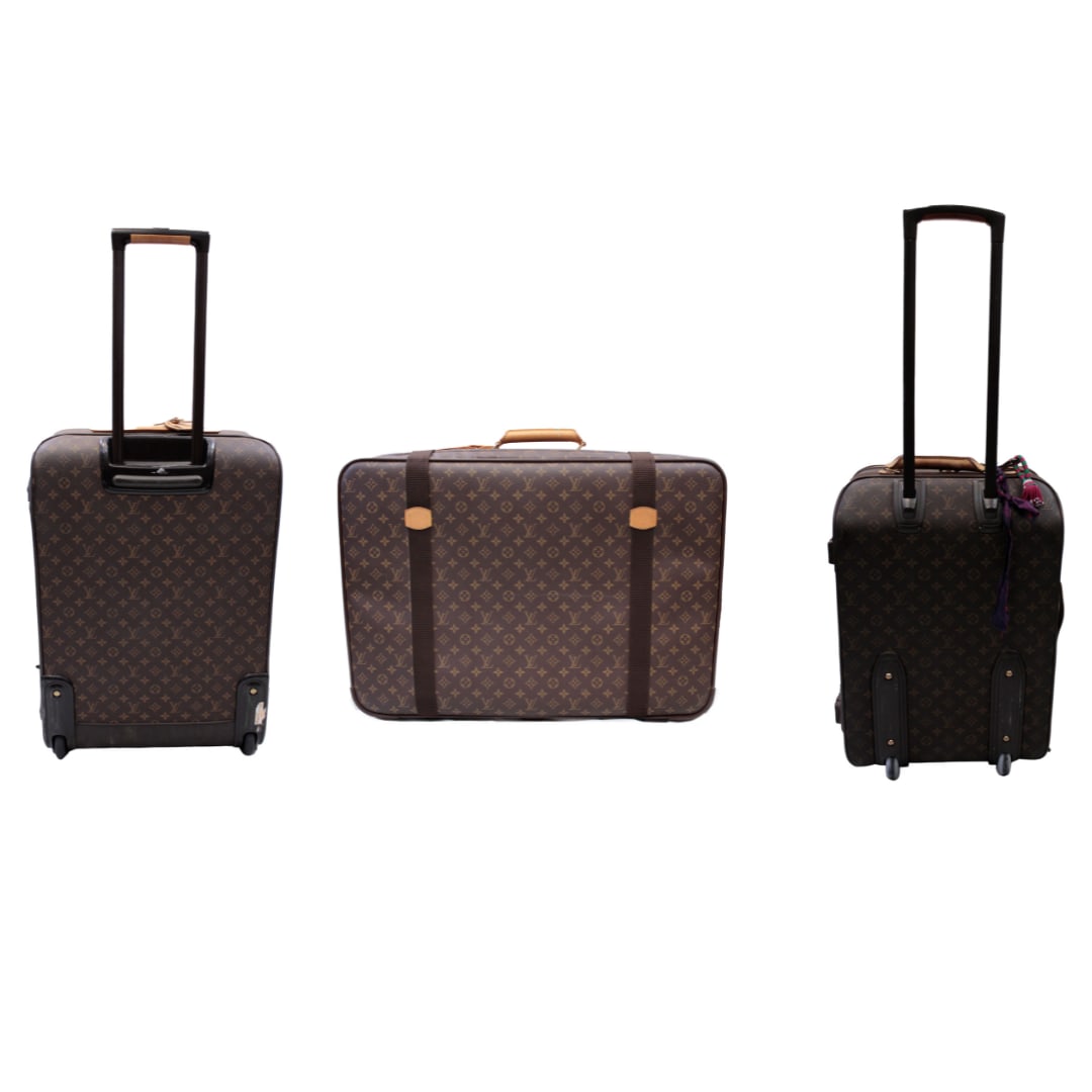 Louis Vuitton Luggage, 3 Pieces: One set of three Louis Vuitton monogram leather canvas luggage pieces. This iconic travel collection includes two upright rolling suitcases and one large flat carry-on, all rendered in the house's sig