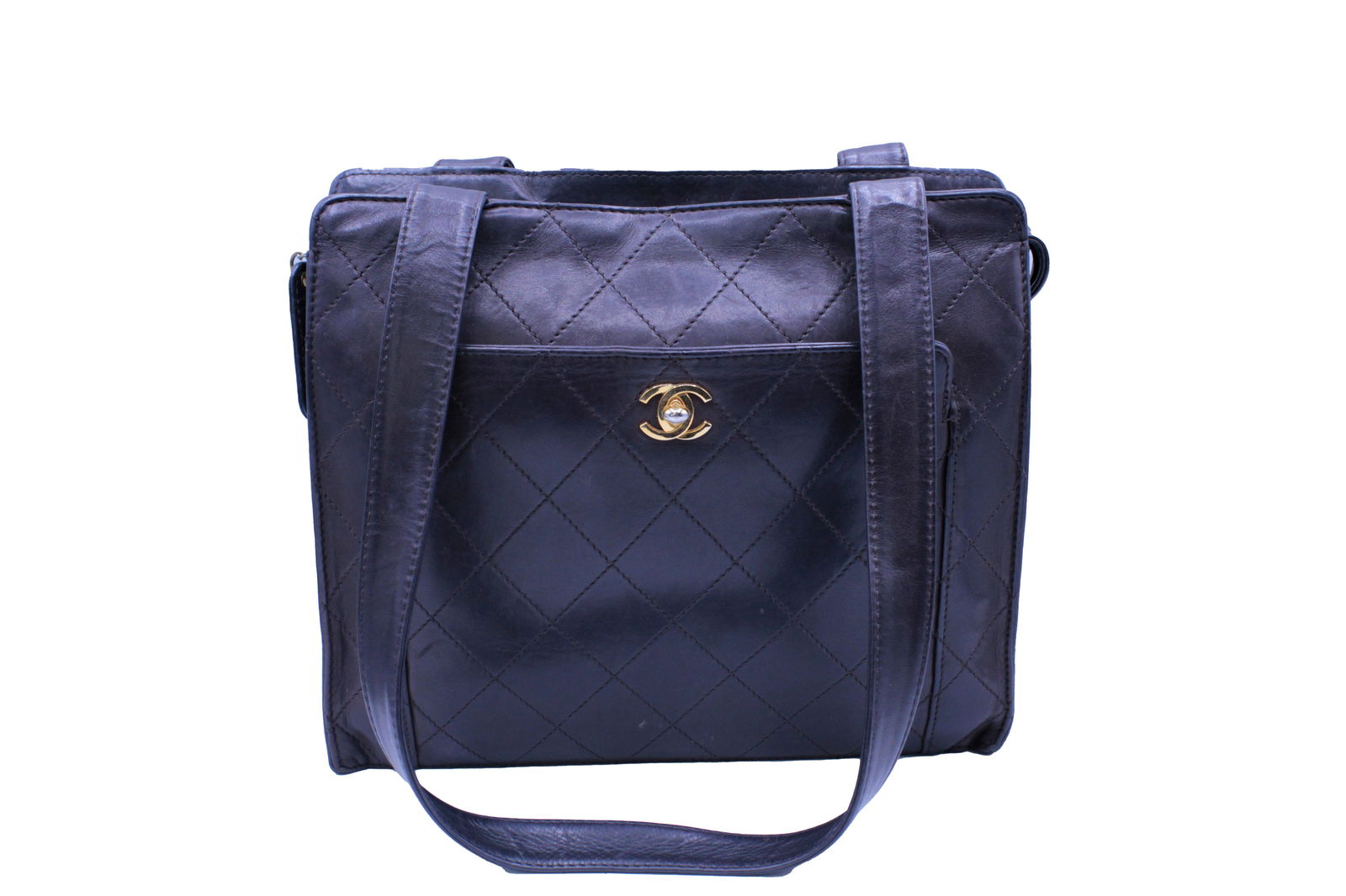 Vintage Chanel Brown Quilted Calfskin Leather Shoulder Bag: One vintage Chanel quilted leather shoulder bag featuring the iconic gold-tone CC logo and dual flat leather straps. This structured, boxy tote design is crafted in Chanel’s classic diamond-quilted