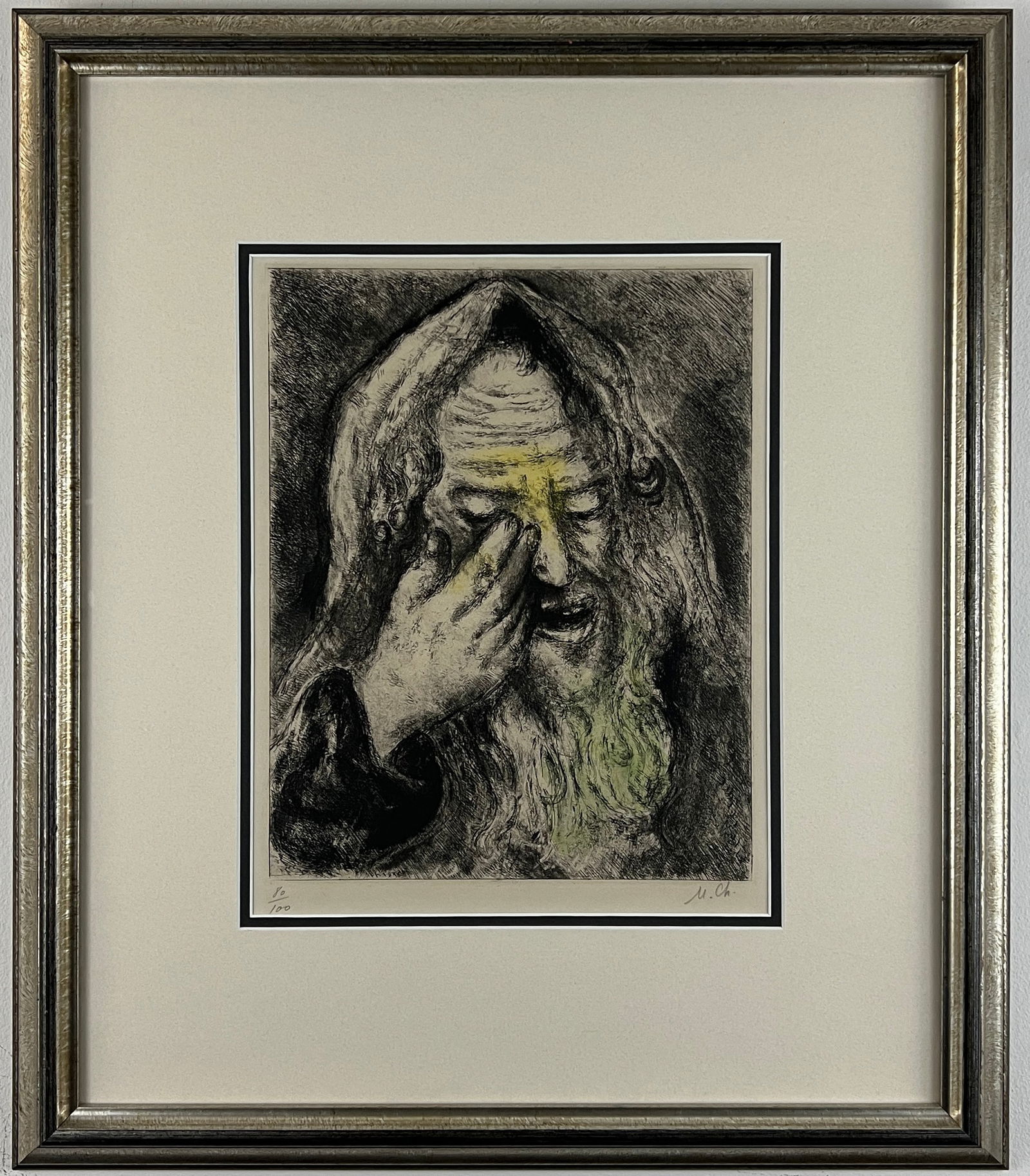 Marc Chagall, "Souffrance de Jérémie", from "The Bible" series, Signed Etching: One signed etching by Marc Chagall depicting a close-up portrait of the prophet Jeremiah wiping tears from his eyes. He is wearing a hooded robe and has a long beard covering his chest. There are pops
