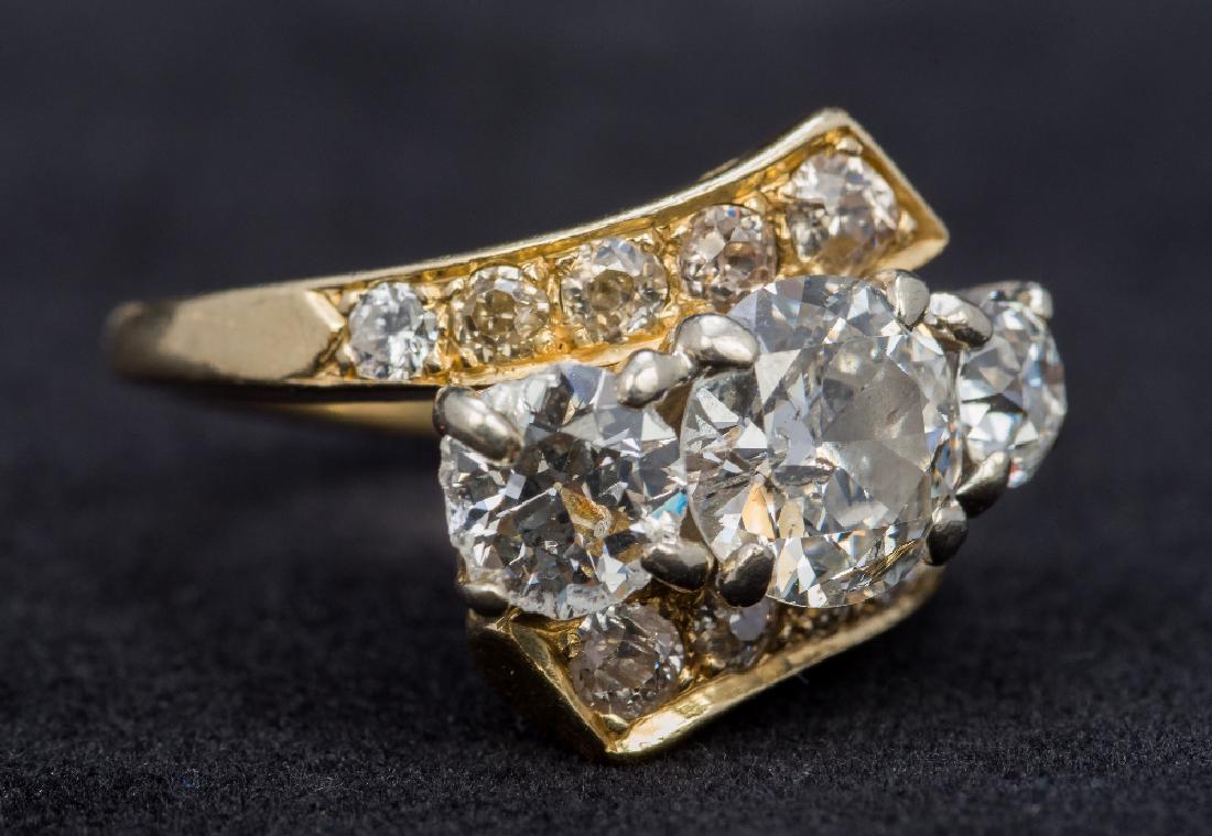 A 14K gold diamond set three stone ring The central (1 of 1)