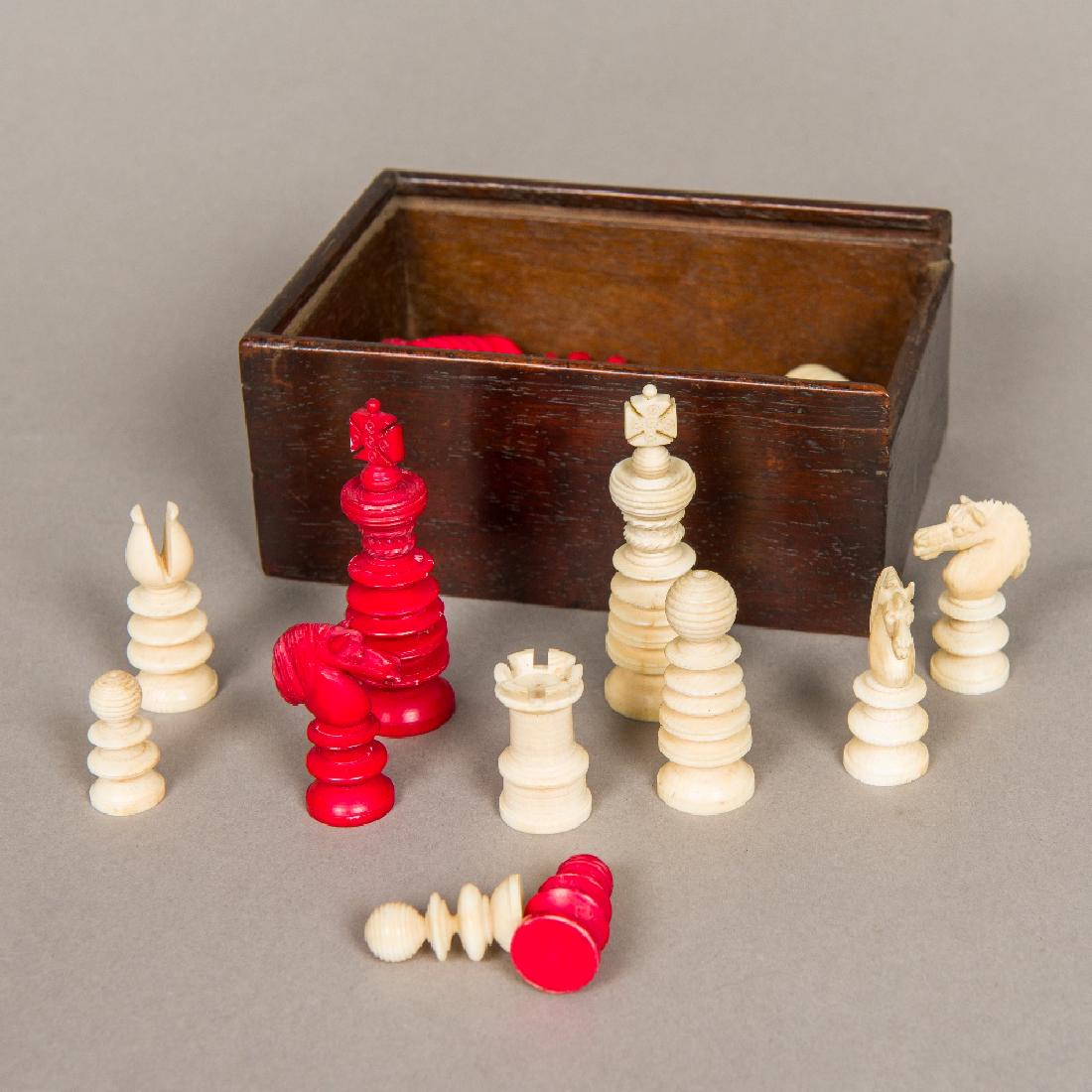 A Victorian English carved ivory chess set Housed in a (1 of 1)