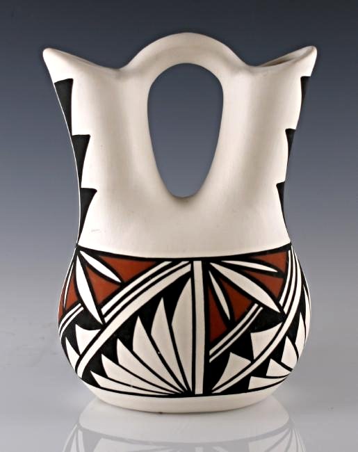 Acoma Pueblo Pottery: Wedding Vase, Signed: Vintage Acoma N.M. Pueblo wedding vase with geometric pattern. Signed "LC/CC". Dimensions: 8" x 6" x 5"