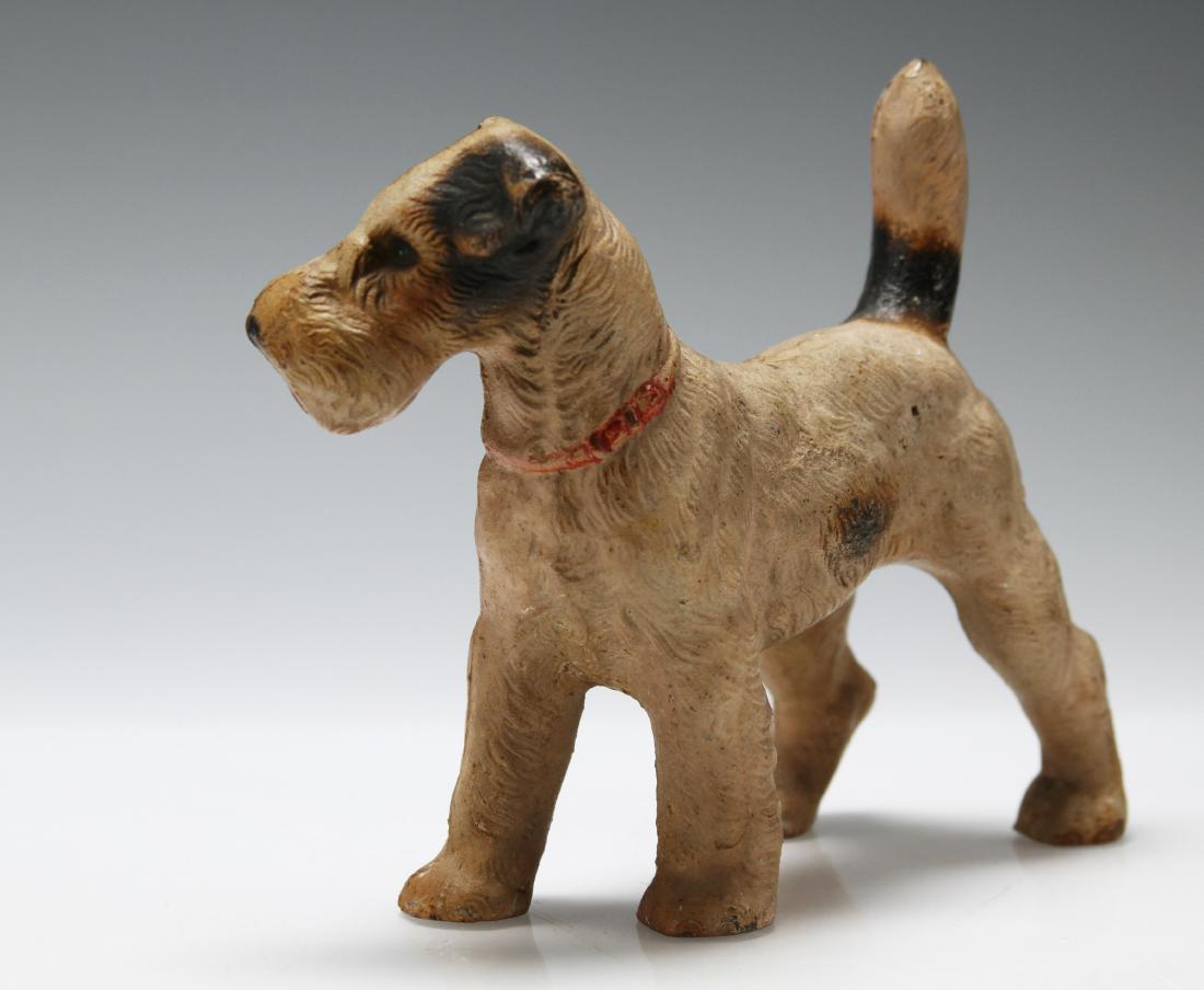 Antique Hubley Terrier Cast Iron Door Stop: This rare mid- Century little fellow is unsigned and believed to be Hubley and appears to still have its original paint. Though traditionally a doorstop, he could be decorative accent to a desk or man