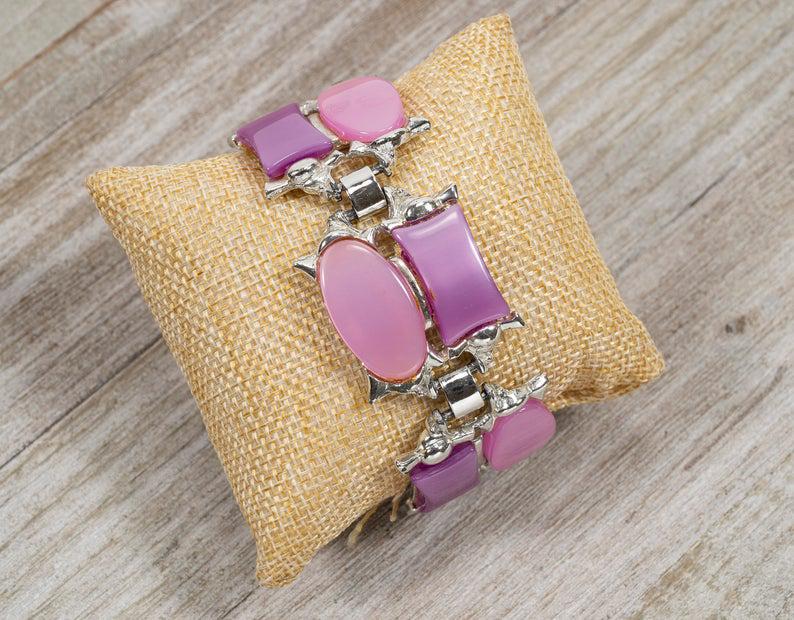Vintage Pink & Lavendar Thermoset Bracelet: Vintage 1950's-60's Wide Pink & Lavendar Thermoset Silvertone 8" Bracelet. This great, retro bracelet is in very good condition. There is minor surface wear and areas of dried glue, mainly to the back
