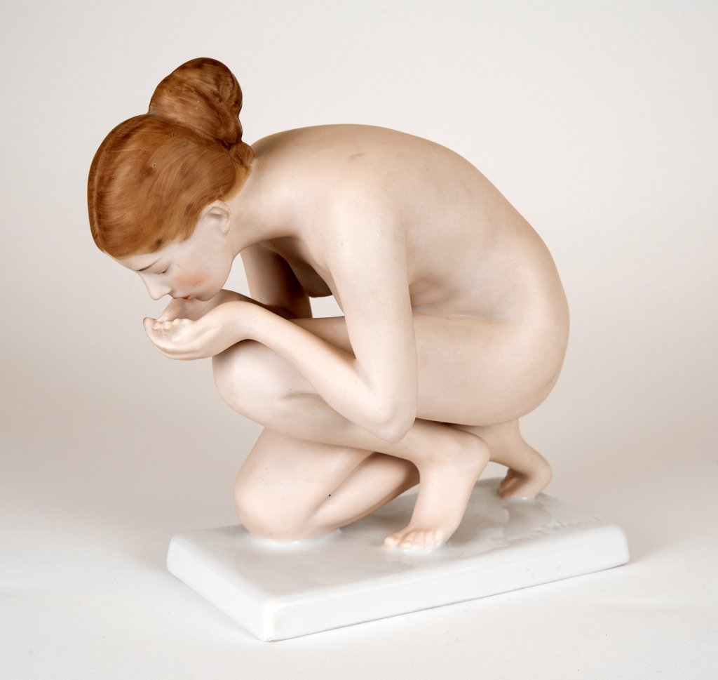 Ernst Wenck Rosenthal Nude Figurine: Item/Description: German porcelain figure of a nude woman crouching for a drink, signed Ernst Wenck on base, marked Rosenthal / Impressed 752/1Signed by artist. Material: Painted porcelain, matte fini