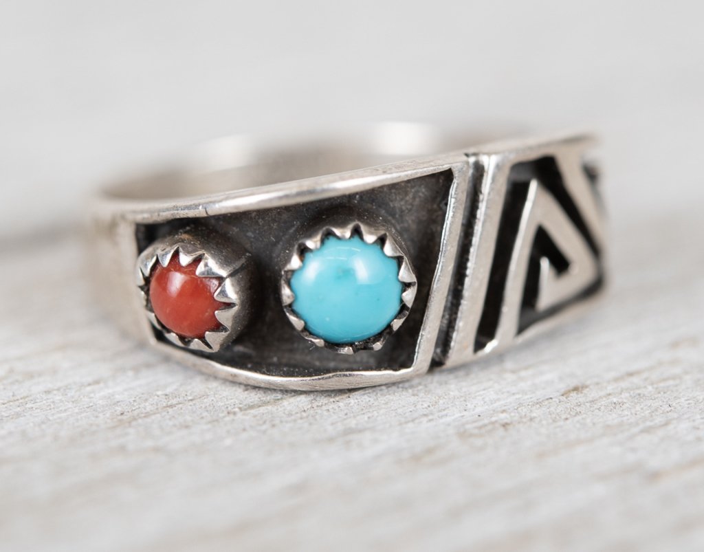 Native American Sterling Turquoise & Coral Ring: Item/Description: Vintage Native American Sterling Turquoise & Coral Band Ring. Bold and Brutalist in form this Southwestern/Native American ring features genuine coral and turquoise cabochons in saw 