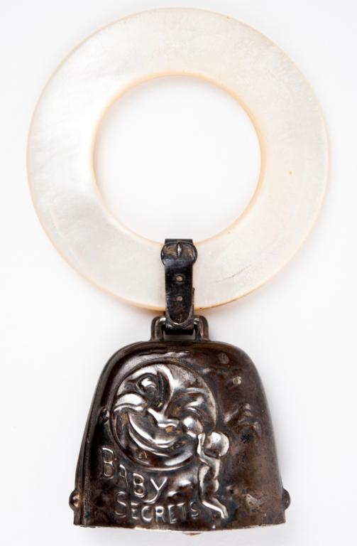 Antique Webster Sterling Man in the Moon Rattle: Item/Description: Antique Man in the Moon Baby Secrets Sterling Silver Rattle. Rare rattle embossed with charming image of smiling moon listening to a whispering baby. Entitled, "Baby Secrets". A buck