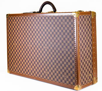 Louis Vuitton Hardsided Suitcase in Damier Ebene: Item/Description: Vintage Early 20th Century Louis Vuitton Suitcase. Iconic luxury traveler suitcase in Damier canvas features brass mountings, latches and lock and leather trim. Hinged lid opens to