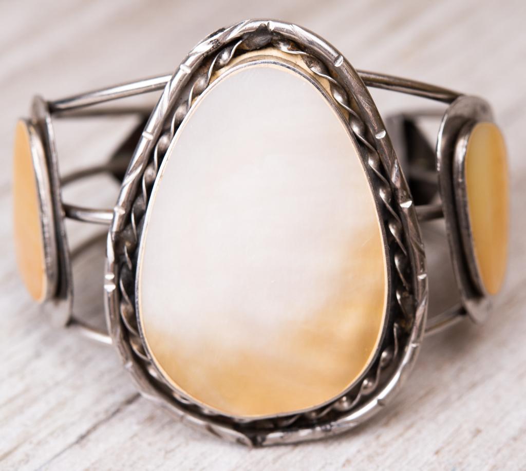 Sterling Native American Abalone Cuff Bracelet: Item/Description: Large, dramatic studio art cuff bracelet in sterling silver features 3 slices of mother of pearl, bezel set and mounted on silver "frames" that mimic the shapes of the pearls. Hand-c