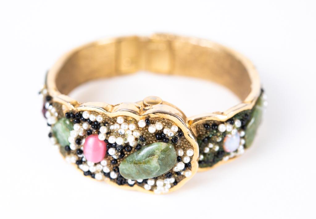 Vintage Norman De Luxe Jeweled Bracelet Watch: Item/Description: Amazing Baroque Jeweled Bracelet Watch by Norman De Luxe. Encrusted in semi-precious green stones, glass opals, pink cabochons, seed pearls and beads. Scalloped, hinged gold bangle b