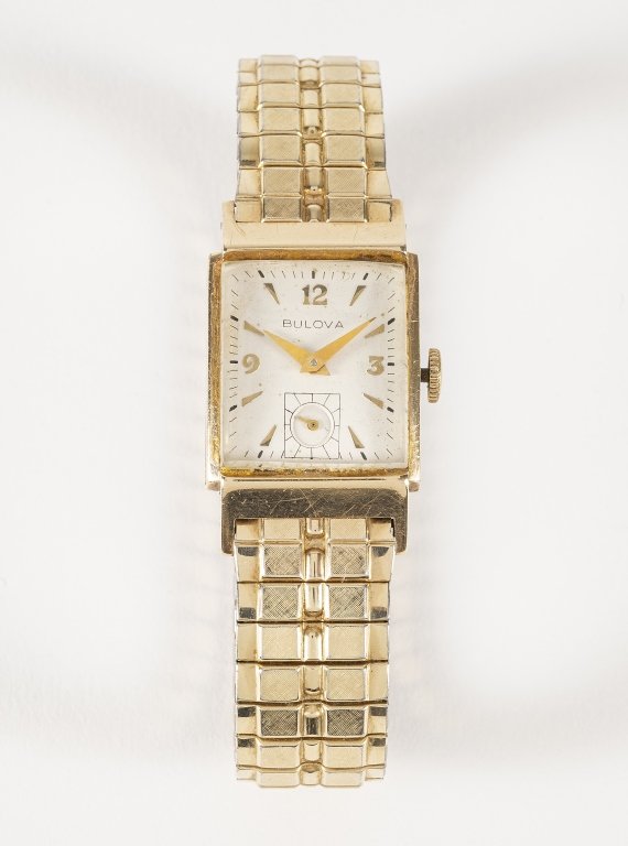 Vintage 10K Gold Filled Bulova Watch: Item/Description: Men's/Women's 10k gold filled Bulova wrist watch. 21J, mechanical, hand wind, rectangular dial, Art Deco. Speidel gold filled stretch band. Material: Gold Filled Dimensions: Case siz