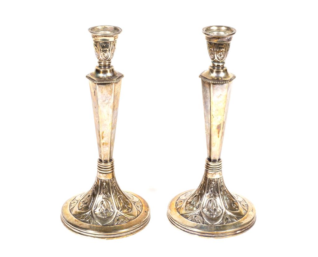 Pair of Antique Austrian Silver Candlesticks: Item/Description: Early 20th century 800 silver Austrian candlesticks. Flower and berry engravings to neck and bases, beadwork detail. Makers marks include toucan. Material: 800 Silver. ( Sabbath cand