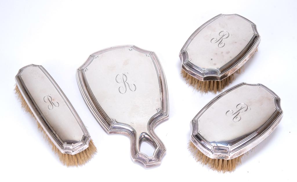 Antique Tiffany & Co. Sterling Vanity/ Dresser Set: Item/Description: Tiffany & Co. Sterling Silver 4 piece set includes hand-held mirror and three brushes; each monogrammed with a script letter R. Hallmarked: Tiffany & Co. Makers / Sterling / 925 M. M