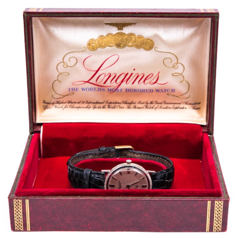 Vintage Longines 14K White Gold Manual Watch w Box: Item/Description: Sleek, Mid-Century Men's Longines 14K White Gold Watch in original presentation box. On black crocodile band. Material: 14K White Gold, Leather. Dimensions: 33mm x 37mm. Size 18L Ban