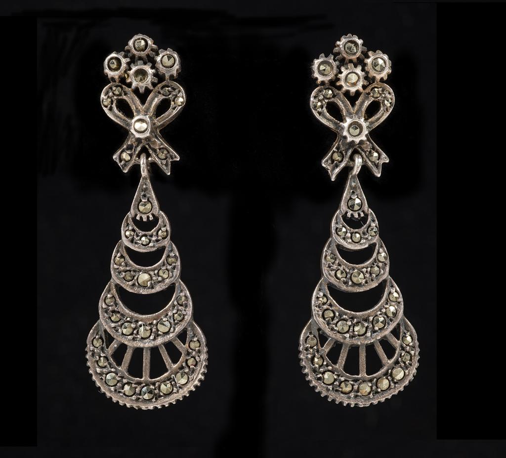 Antique Sterling & Marcasite Pierced Earrings: Item/Description: Dainty antique earrings combine Art Nouveau and Deco motifs: Floral and bow posts with geometric, fan-shaped drops. Butterfly backs. Unmarked. Tested as Sterling. Material: Sterling 