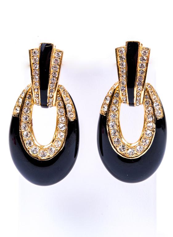 Ciner Black Enamel & Crystal Pierced Earrings: Item/Description: Signed Ciner geometric gold-tone drop earrings. Black enamel, encrusted with clear, quality hand-set crystals. Elongated "U" shape drops swing from Deco style clips at ear lobe. Pier