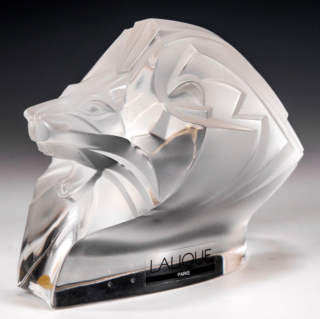 Lalique King Lion: Item/Description: Tete De Lion King figurine by Lalique France. Signed on bottom. Original label attached. Includes original Lalique box and packaging as shown. (African Animal, Art Glass, Paperweight