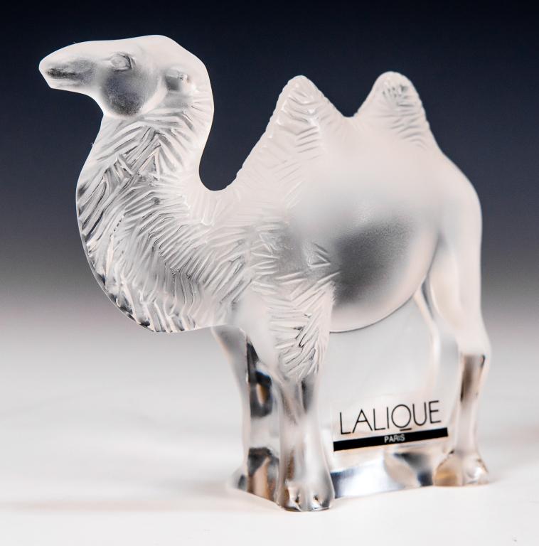 Lalique Chameau Tanger Camel Sculpture: Item/Description: Frosted glass camel figurine by Lalique France. Signed. Includes original Lalique box and packaging as shown. (Art Glass, Animal Figure) Material: Glass. Dimensions: Height: 3"; Widt