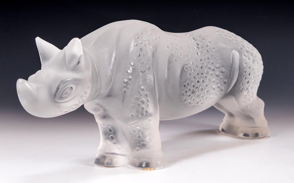 Lalique Crystal Rhinoceros 'Toba' Sculpture: Item/Description: Frosted glass figure of a Rhino by Lalique France. Signed on bottom. Includes original Lalique box and packaging as shown. (Art Glass, African Animal Figurine) Material: Glass. Dimen