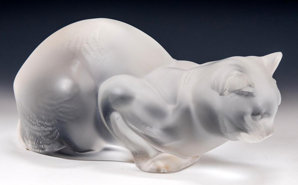 Lalique Crystal 'Chat Couche' Crouching Cat: Item/Description: Frosted glass cat figure by Lalique France. Signed on bottom. Includes original Lalique box and packaging as shown. (Art Glass, Sculpture) Material: Glass. Dimensions: Height: 4 1/4"