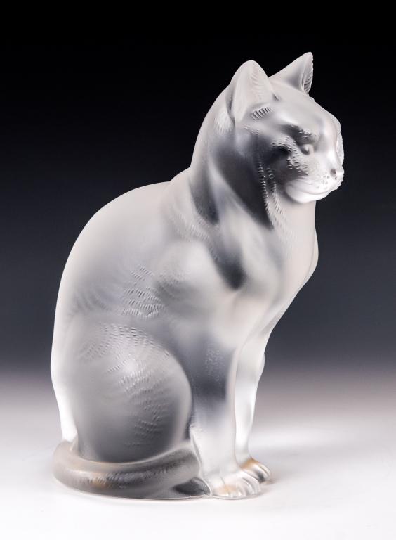Lalique Glass Sitting Cat Sculpture: Item/Description: Frosted glass figure of a seated cat by Lalique France. Signed on bottom. Includes original Lalique box and packaging as shown. (Art Glass, Animal Figurine) Material: Glass. Dimensio