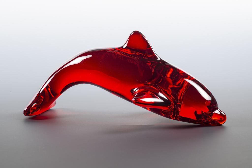 Daum Dolphin Art Glass Sculpture in Red: Item/Description: Red crystal dolphin figurine Signed Daum France. (Sea life, Collectible, paper weight) Material: Glass. Dimensions: Height: 2"; Width: 4 1/2". Condition: Minor surface wear. No notic