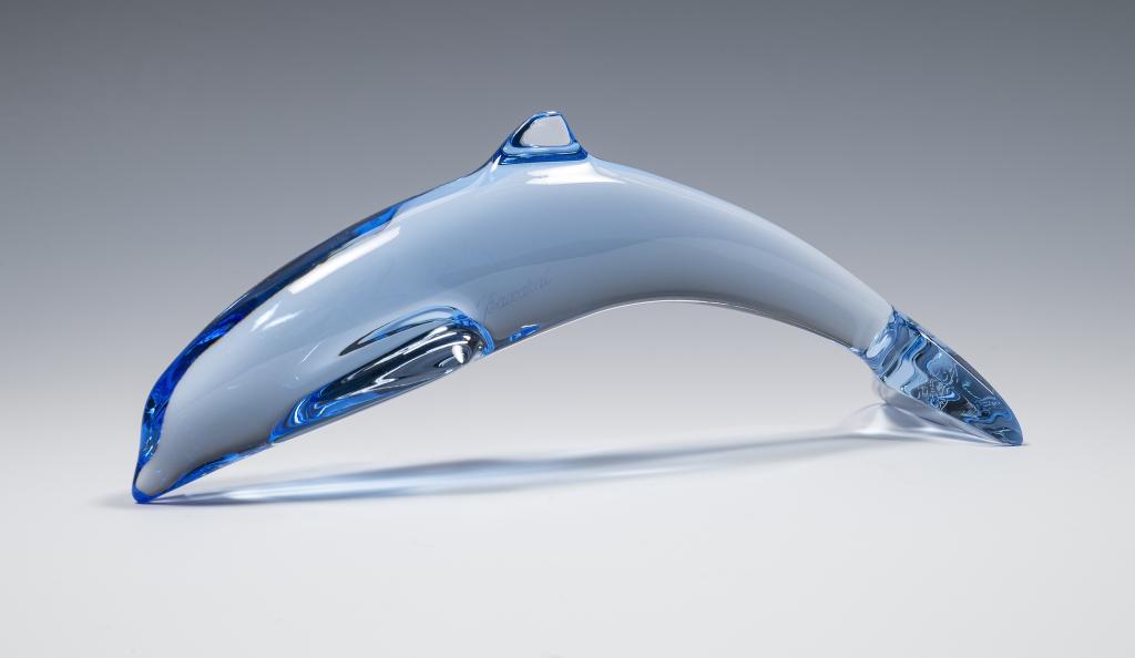 Baccarat Crystal 'Dolphin Playing' Figurine: Item/Description: Signed blue crystal glass dolphin sculpture. Signed and marked. Includes original packaging as shown. Material: Glass. Dimensions: Height: 2 1/2"; Width: 6". Condition: Minor surface