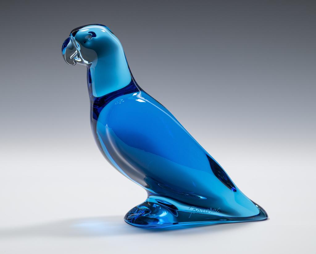 Signed Baccarat Blue Glass Parrot Figurine: Item/Description: Sapphire Blue Crystal Parrot. Signed on side, makers mark on bottom. Art glass sculpture. Material: Glass. Dimensions: Height: 3 3/4"; Width: 4 1/2". Condition: Minor surface wear. N