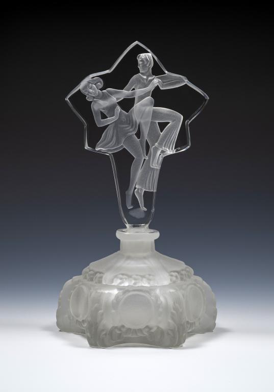 Art Deco Glass Perfume Bottle, Jitterbugs: Item/Description: Czech perfume bottle with stopper that features dancing couple. Frosted and clear glass. (Cio Collection) Material: Glass. Dimensions: Height: 7 1/2"; Width: 3 1/2". Condition: Minor