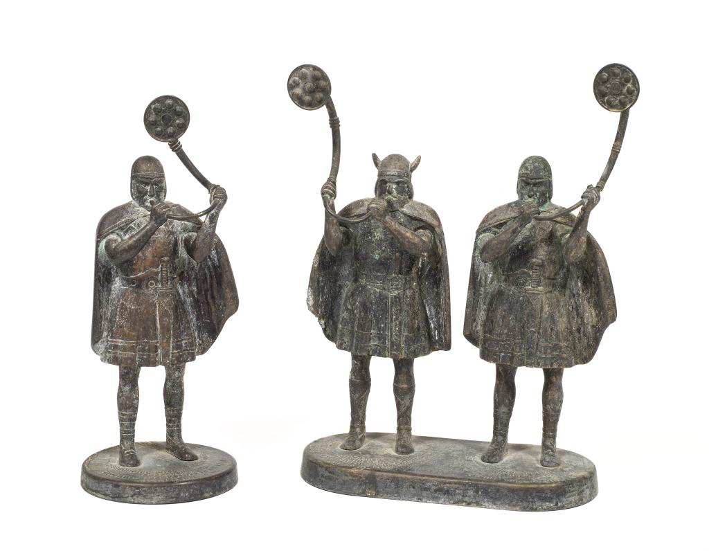 Edward Aagaard Sculptures of Viking Soldiers: Item/Description: Two sculptures of vikings playing "Lur" horns, calling their men to battle. They feature a battle poem at each of the warrior's feet. It is the same poem, one is in Danish and the ot