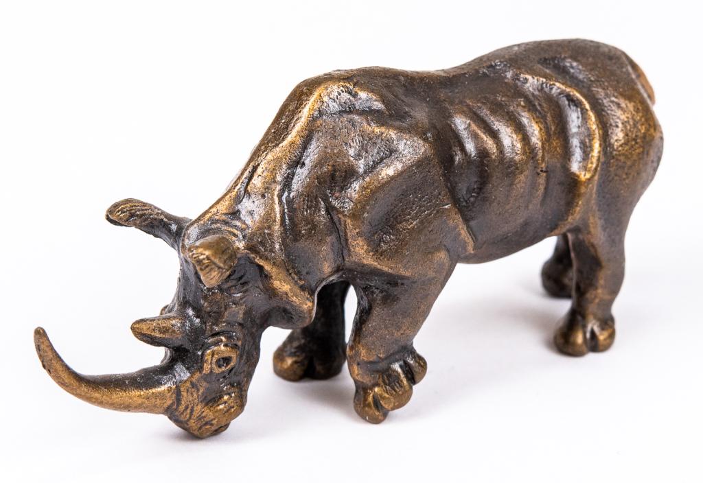 Miniature Bronze Rhinoceros Figurine: Item/Description: Miniature figurine of a rhino. Marked Lori 1976. Material: Bronze. Dimensions: Length: 3"; Width: 1"; Height: 1 1/2". Condition: Minor surface wear. Age: Second half 20th century.