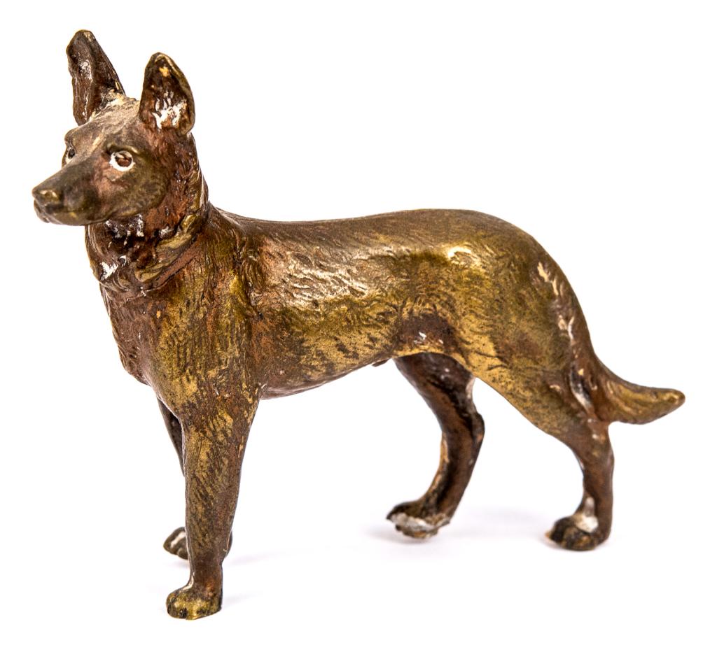 Miniature Bronze German Shepard: Item/Description: Bronze miniature figurine of a dog. Marked Lori 1976. Material: Bronze. Dimensions: Length: 3 1/4"; Width: 1"; Height: 2 3/4". Condition: Minor surface wear. Age: Second half 20th ce