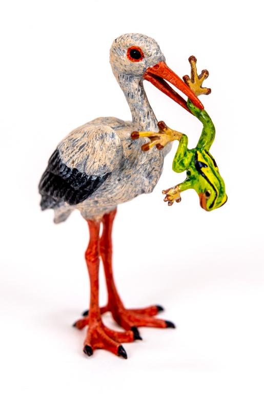 Vienna Cold Painted Bronze Stork with Frog: Item/Description: Petri Bronzen Vienna cold painted bronze miniature figurine features a stork holding a frog in its mouth. Austrian cold painted bronze sculpture. Petri Bronzen was a Vienna based com
