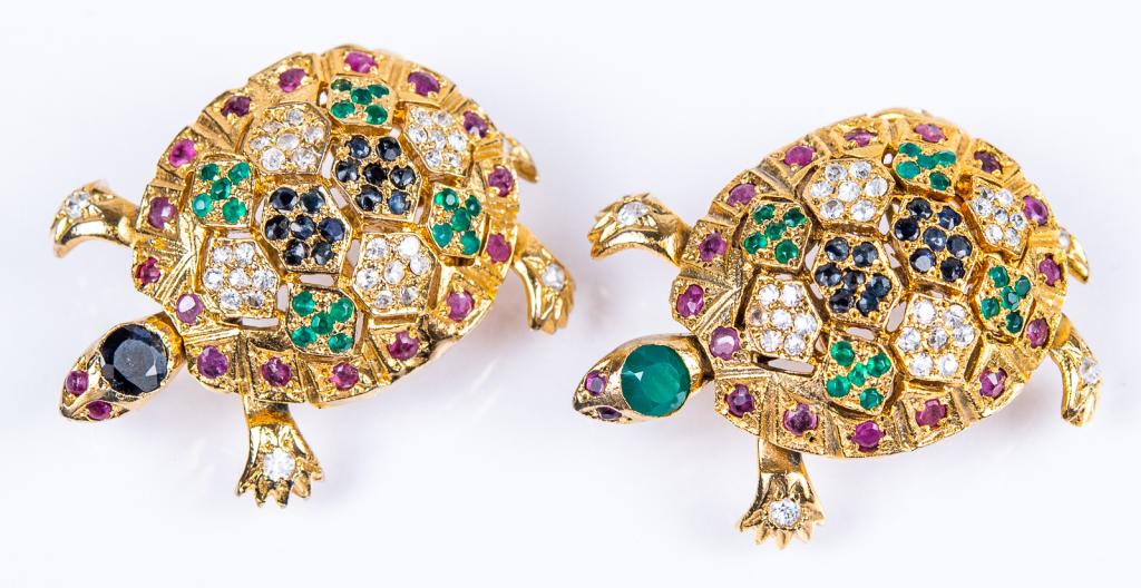 Vintage Jeweled Turtle Pendant Pin Lot: Item/Description: Rare and exquisite pair of jewel encrusted turtles tortoises designed as brooch pendants. Gold tone domed mountings covered in glass sapphire, emerald, ruby and diamond gemstones. In