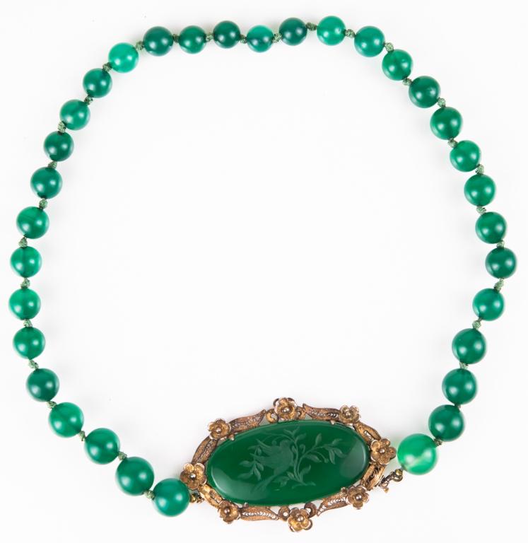 Art Nouveau Carved Chrysoprase Choker Necklace: Item/Description: Antique Art Nouveau Carved Chrysoprase Bead Necklace. Rare choker. Center medallion clasp of oval sliver of chrysoprase with hand- etched bird in foliage design. Prong set in filigre